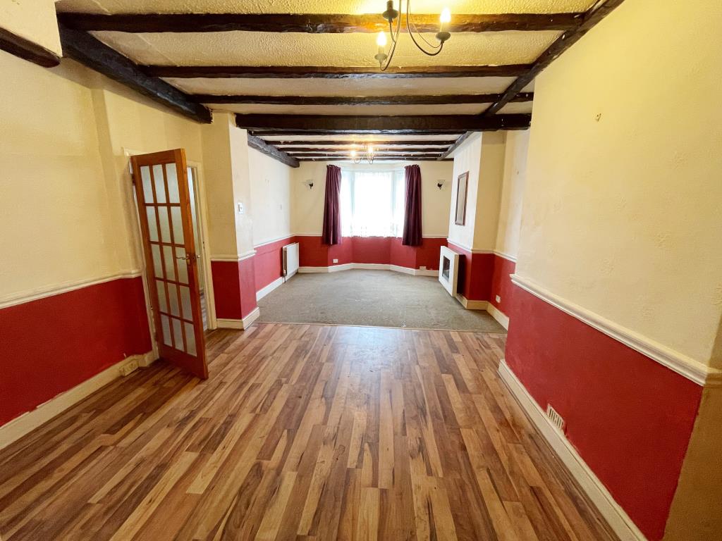 Lot: 77 - MID-TERRACE HOUSE FOR IMPROVEMENT IN TOWN CENTRE - Living room/dining room